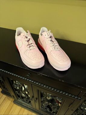 Nike Pink Low-Top Sneakers with Red Heel Accent